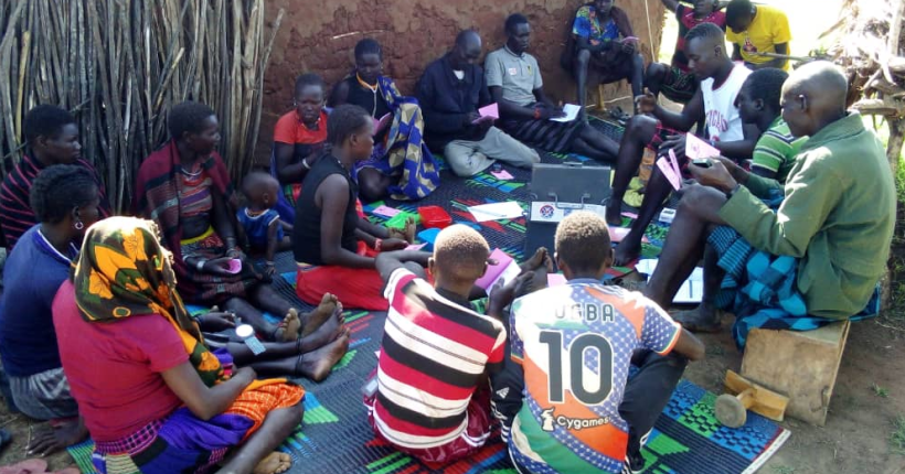 Members of a community in Moroto attend a savings activity. Photo Credit: RIAMIRIAM CSO Network